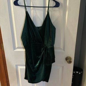Green Mini Dress. Design on front, Sparkle Detail.  Dark Green, Velvet Material.